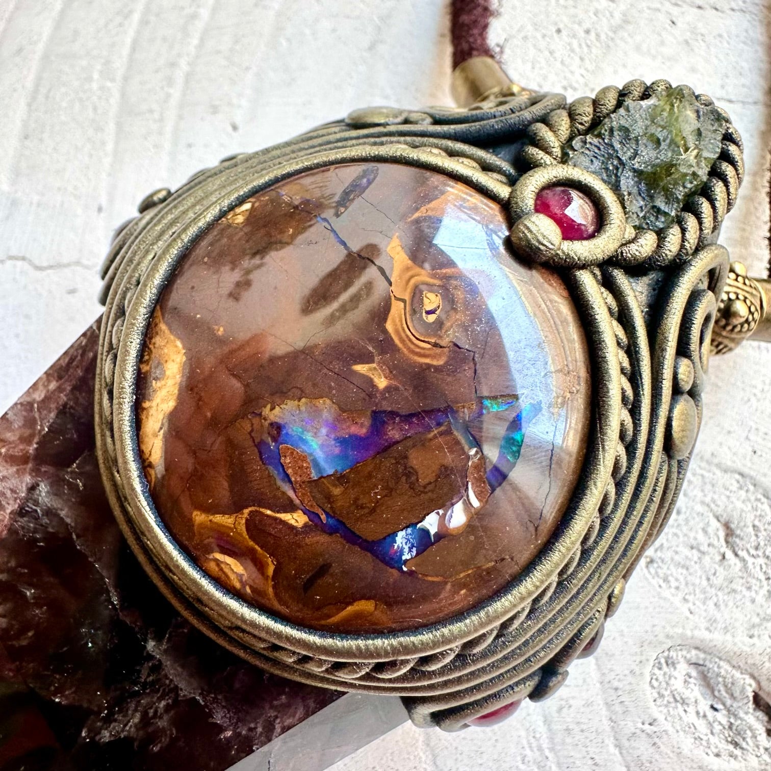 Statement crystal pendant combining Super Seven Quartz with rare opal and natural gemstones.