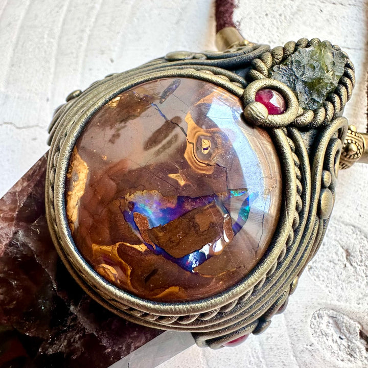 Statement crystal pendant combining Super Seven Quartz with rare opal and natural gemstones.