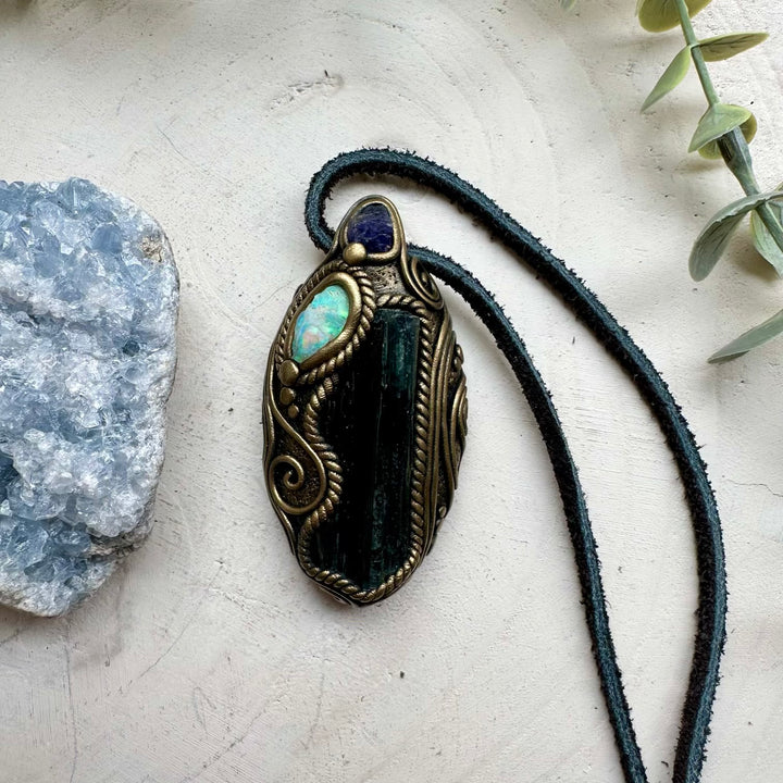 Raw Ethiopian opal paired with vivianite and tanzanite