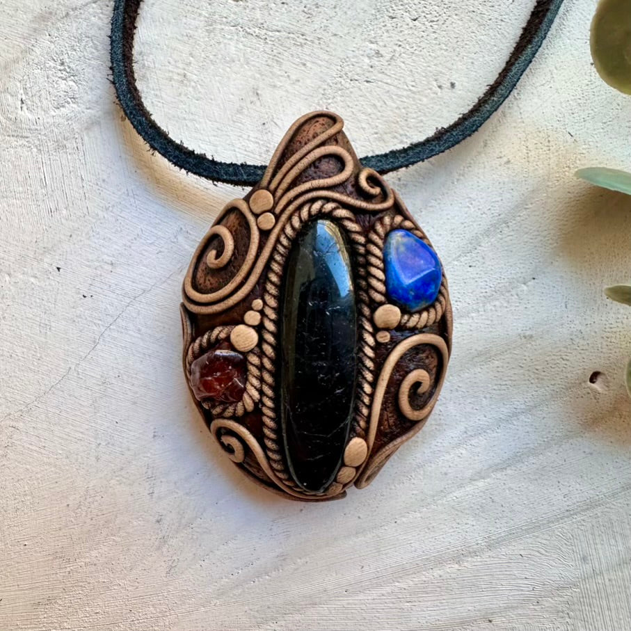 Handmade necklace featuring black tourmaline lapis lazuli and garnet