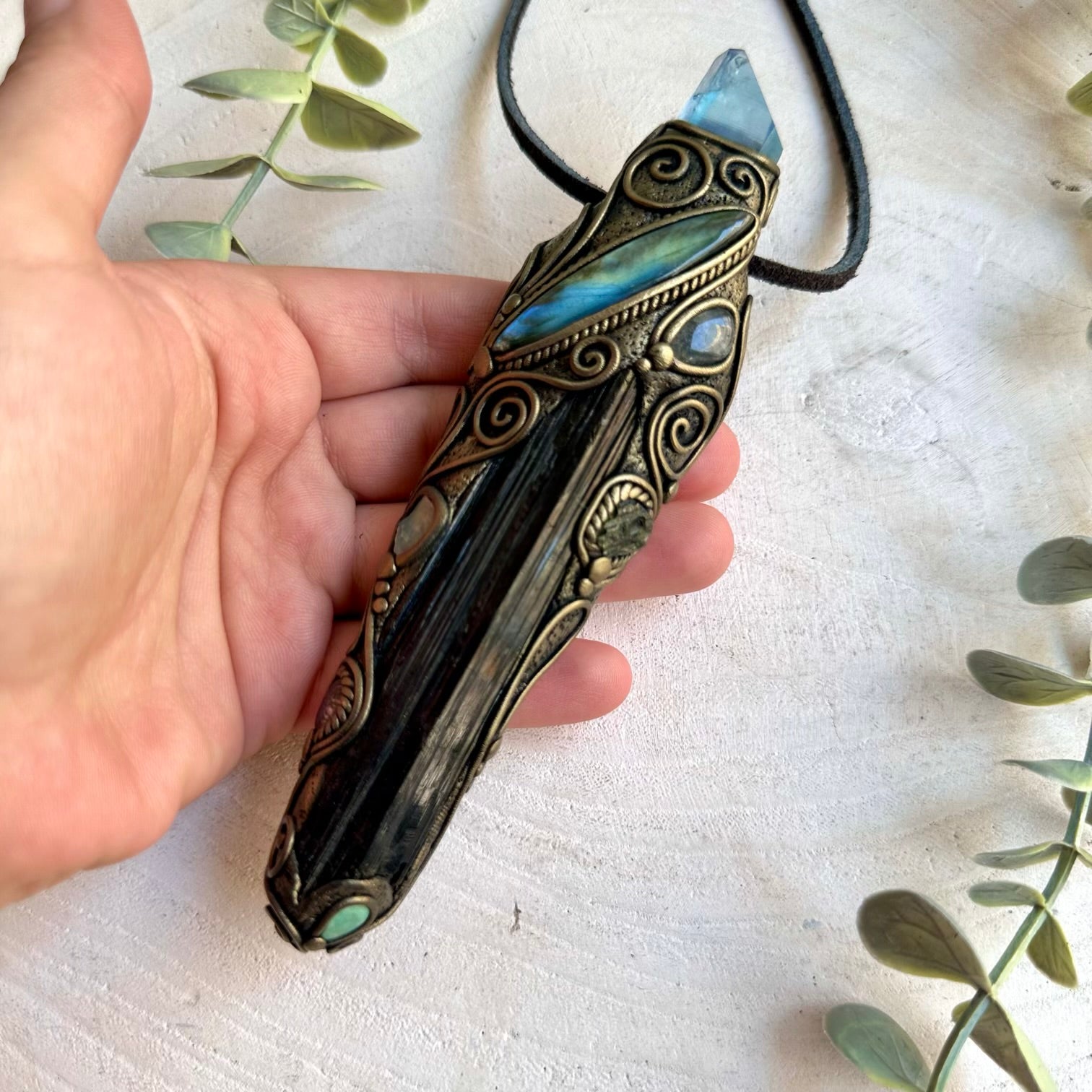 Handmade Long Raw Black Tourmaline healing crystal wand and talisman necklace featuring Aqua Aura Quartz, Labradorite, Raw Ethiopian Opal, Clear Topaz and Moldavite. A one of a kind spiritual energy tool combining grounding black crystal with luminous and iridescent gemstones, created for protection, transformation, intuition, clarity and energy work.