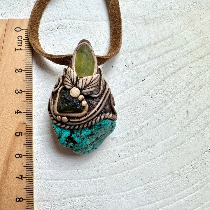 Spiritual crystal necklace featuring Moldavite, Peridot and Turquoise for transformation and balance
