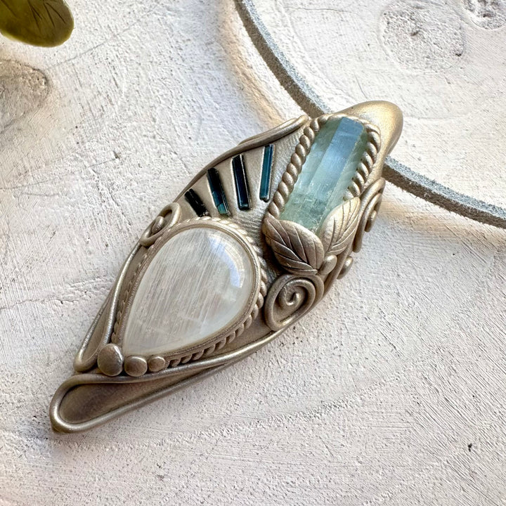Aquamarine paired with blue tourmaline and moonstone in a necklace