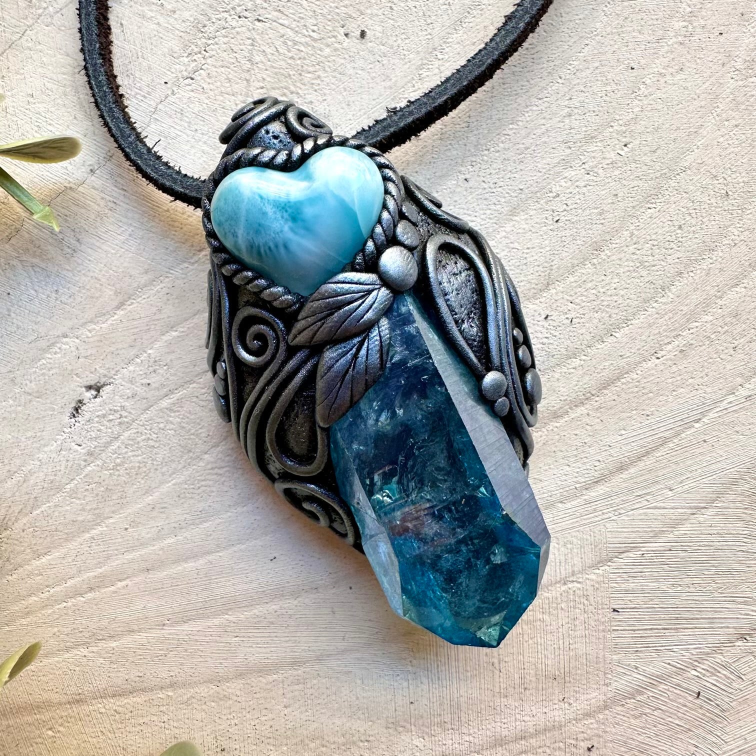 Energy pendant with aura quartz and larimar heart