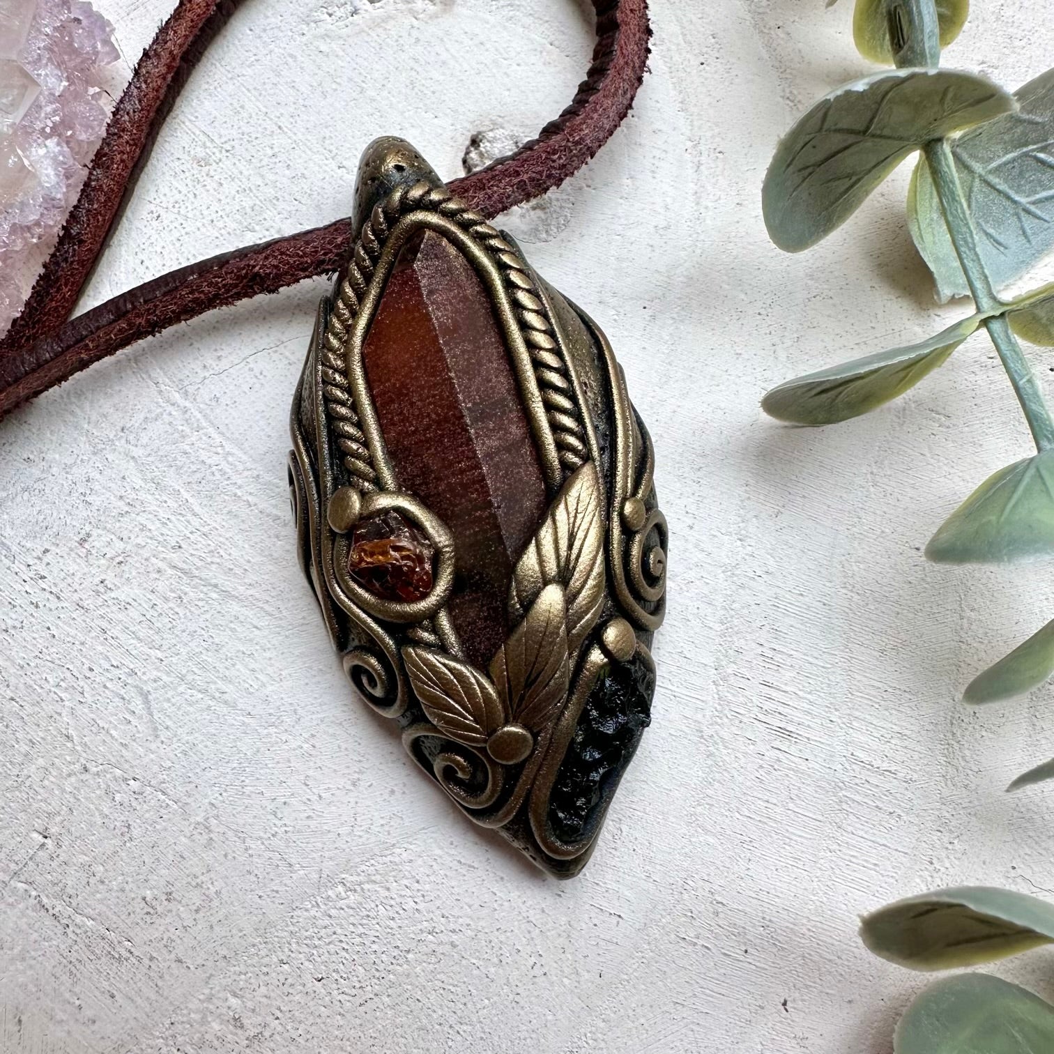 Red quartz paired with moldavite and hessonite garnet