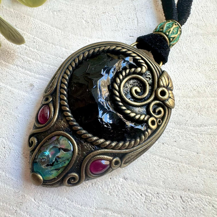 Unique crystal pendant combining Black Obsidian Moon with ocean-inspired Abalone and Garnet.