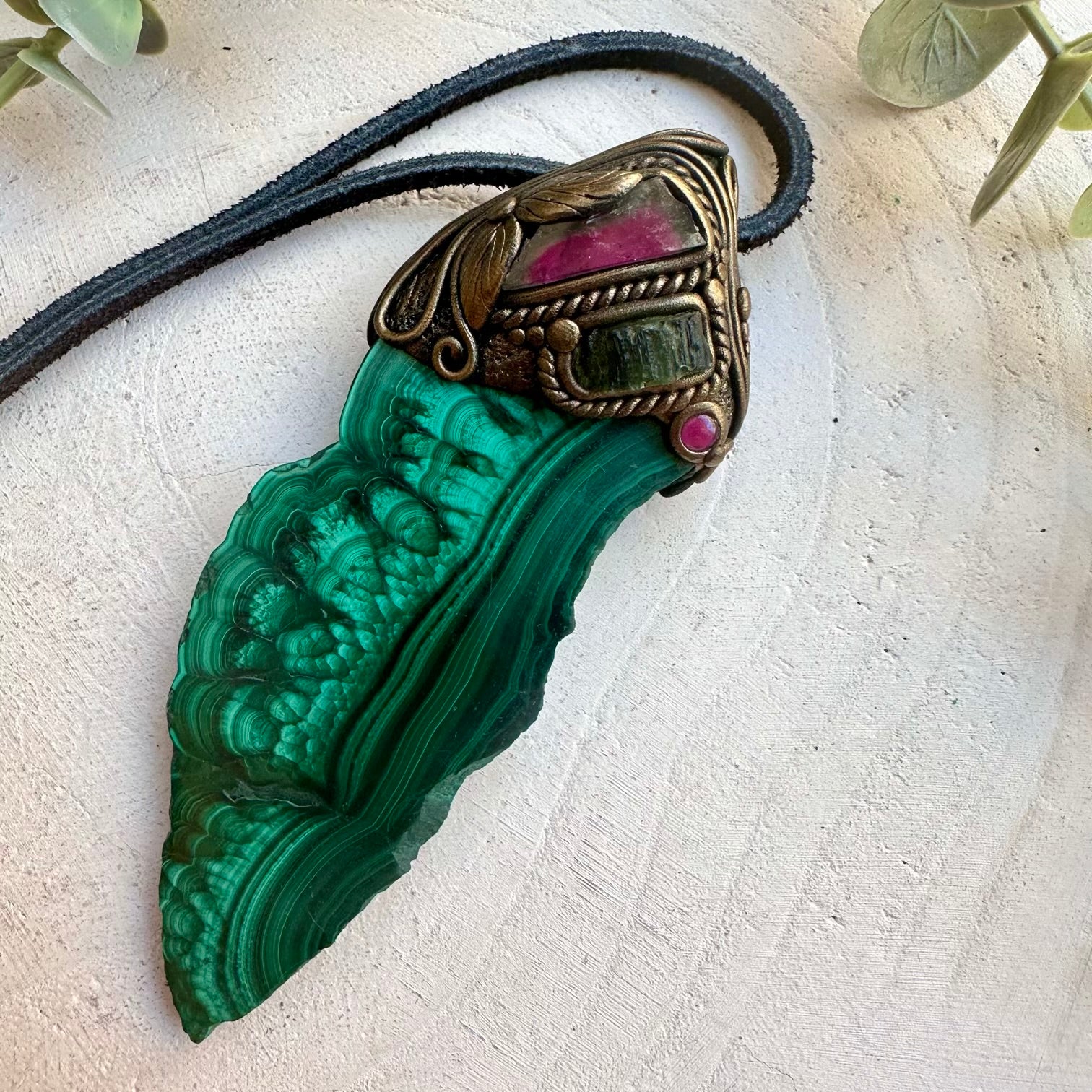 Malachite paired with moldavite in a spiritual wand pendant necklace