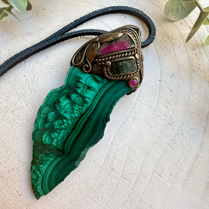 Malachite paired with moldavite in a spiritual wand pendant necklace