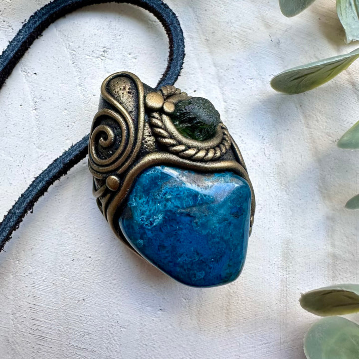 Natural shattuckite paired with moldavite in a unisex necklace