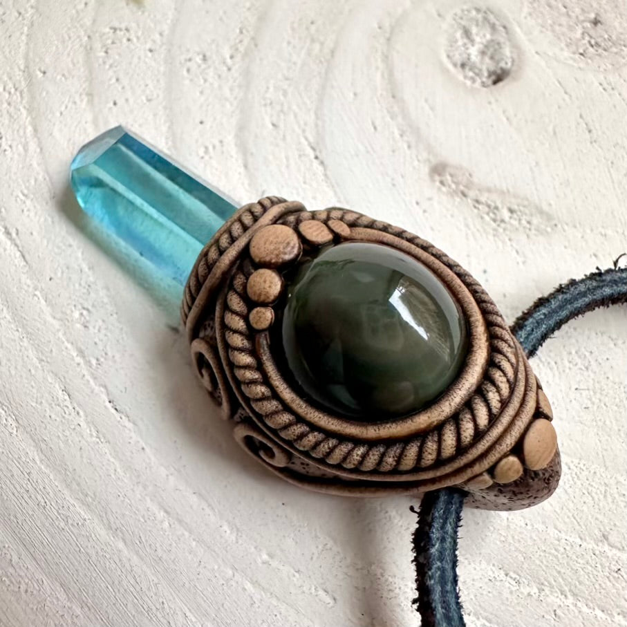 Aqua Aura Quartz crystal pendant with polished Rainbow Obsidian