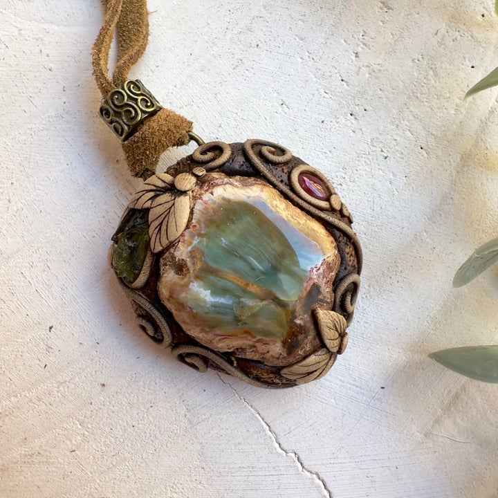 Grounding transformation necklace with petrified wood and garnet