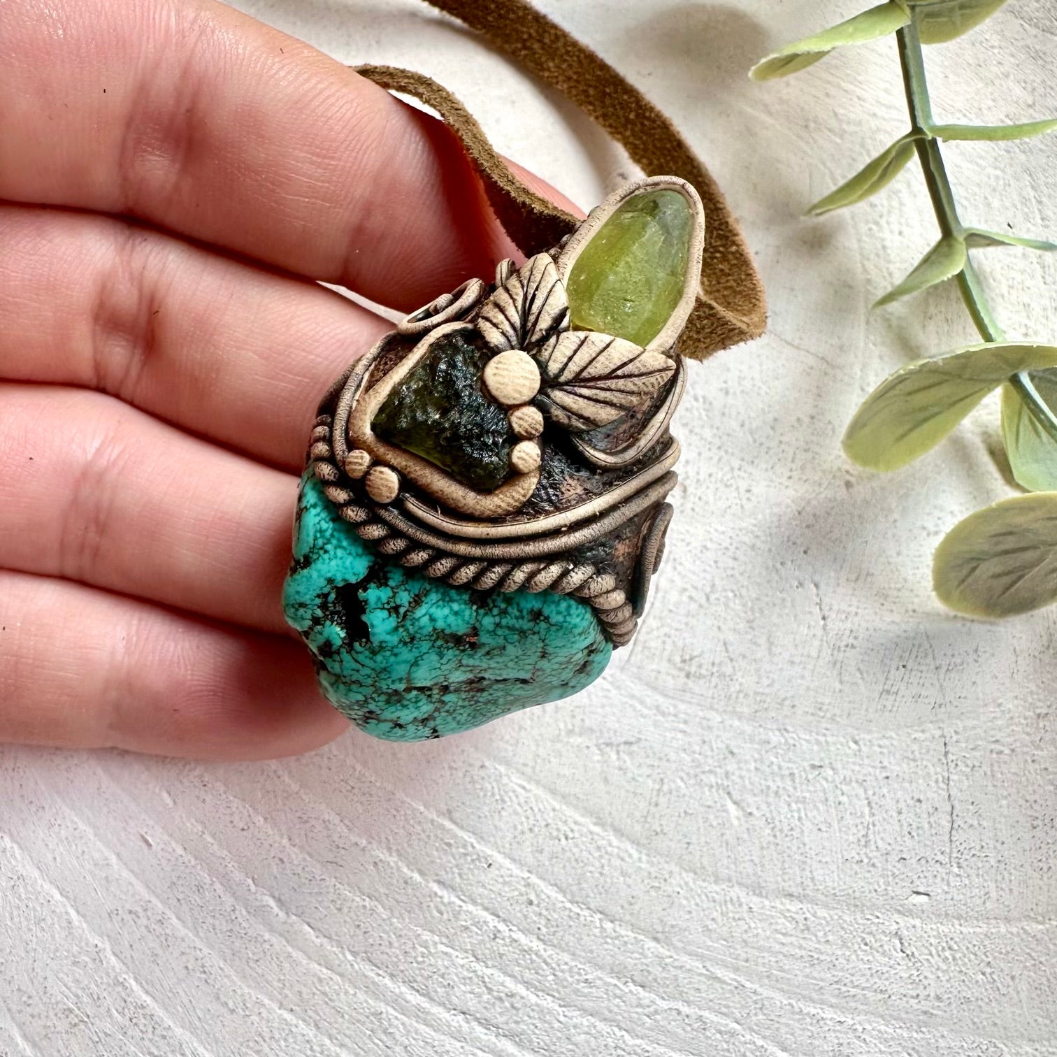 Premium artisan healing stone necklace featuring Moldavite, Turquoise and Peridot pendant