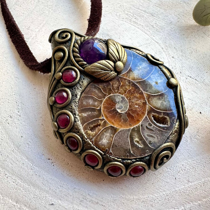 Ammonite with Amethyst and Rhodolite Garnet necklace, handcrafted as a unique healing crystal pendant.