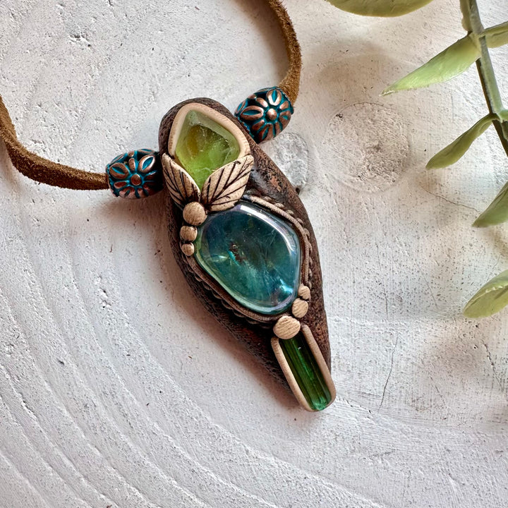 Boho crystal pendant necklace with Aqua Aura Quartz and green gemstones for spiritual jewelry lovers
