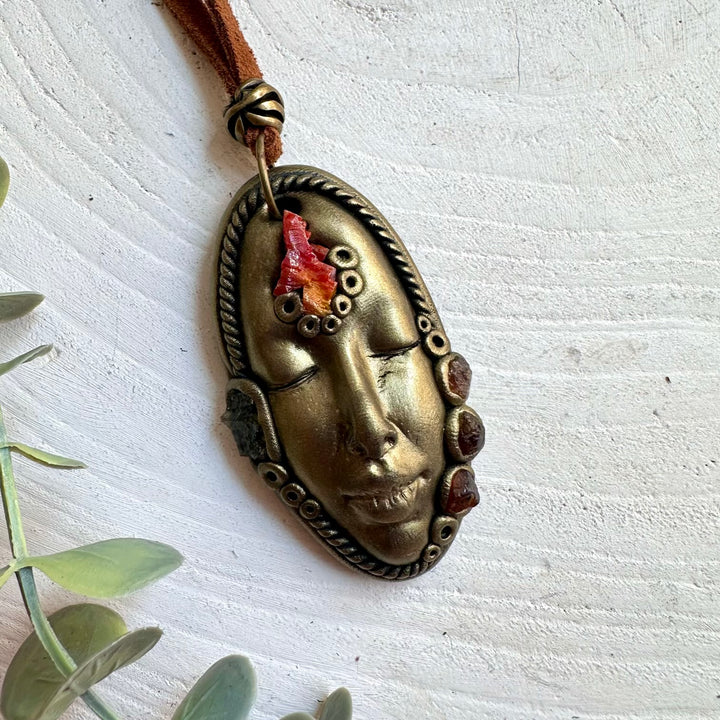 Unique Goddess jewelry featuring red Vanadinite crystals and green Moldavite with warm Garnet accents.