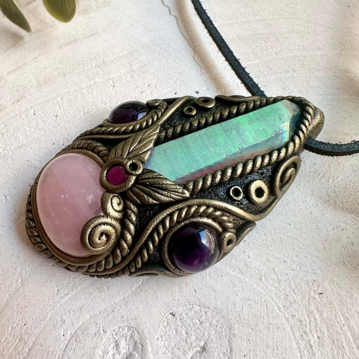 Spiritual crystal necklace designed with Rose Quartz, Amethyst and Rhodolite Garnet in a handmade clay setting.