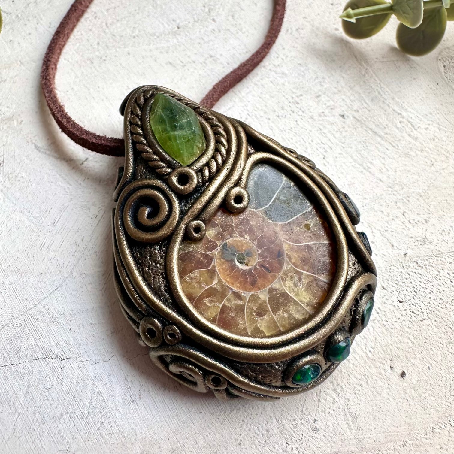 Witchy fantasy crystal necklace with ammonite fossil pendant and black Ethiopian opal gemstones