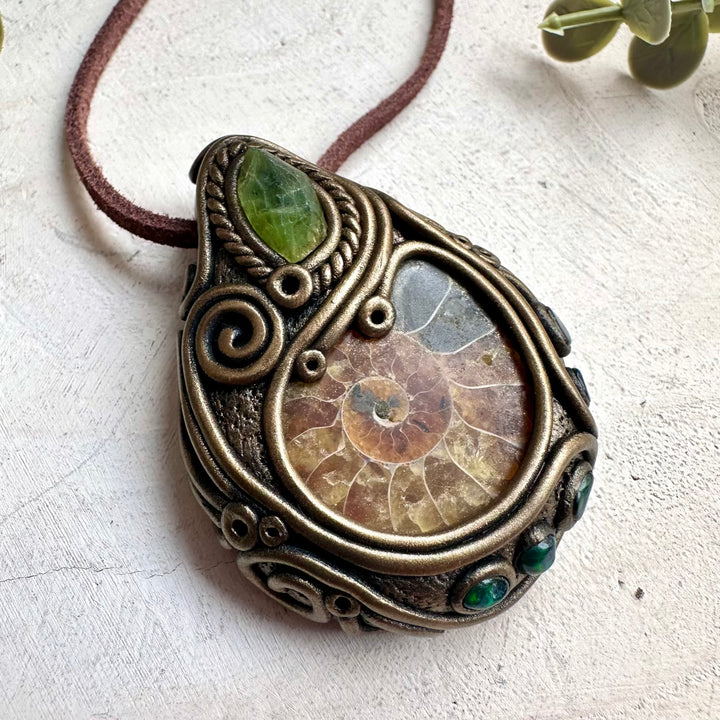 Witchy fantasy crystal necklace with ammonite fossil pendant and black Ethiopian opal gemstones