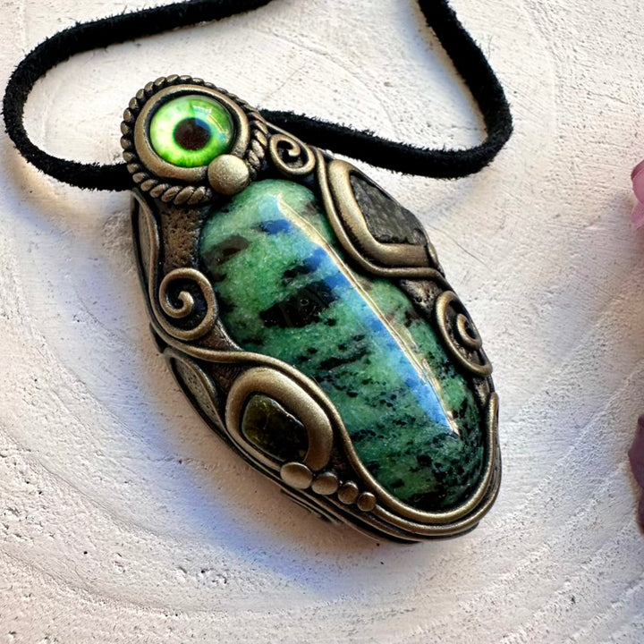 Spiritual eye amulet necklace featuring raw-look imperfect Moldavite and soothing Green Tourmaline paired with Green Zoisite, handmade with intention.